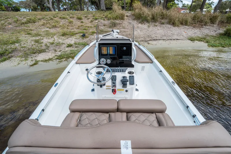 Slide: The Image of Interior view of Avid 23 Fusion boat, 2026 model, by the shore. - 6