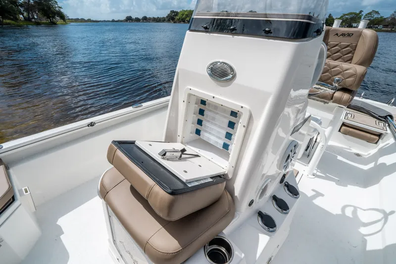 Slide: The Image of Avid 23 Fusion 2026 boat with comfortable seating and storage by the lake. - 20
