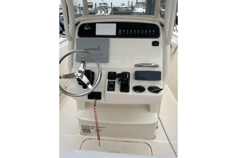 Slide: The Image of 2018 Grady-White Fisherman 236 boat console with Garmin navigation system and steering wheel. - 3