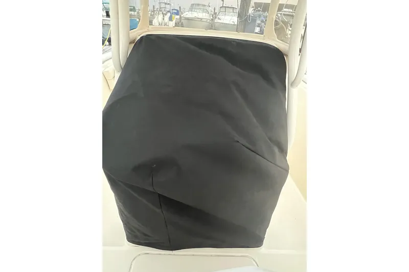 Slide: The Image of 2018 Grady-White Fisherman 236 console covered with a black protective cover. - 4