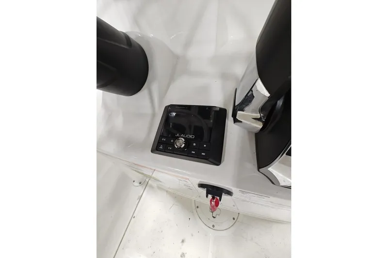 Slide: The Image of 2025 Boston Whaler 190 Montauk dashboard featuring JL Audio system controls. - 12