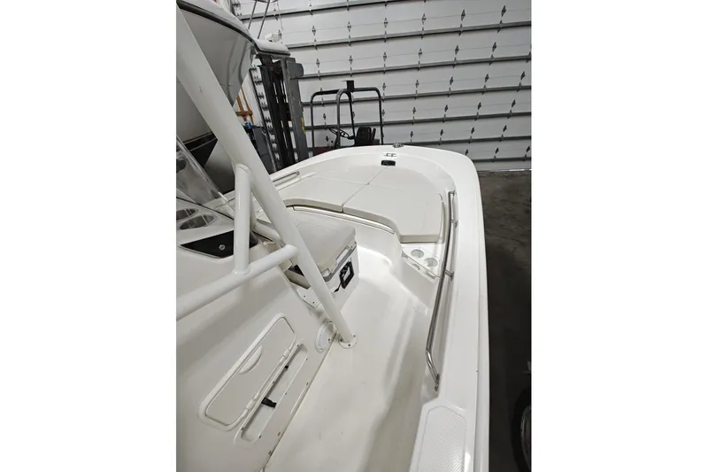 Slide: The Image of 2025 Boston Whaler 190 Montauk boat interior in a garage setting. - 13