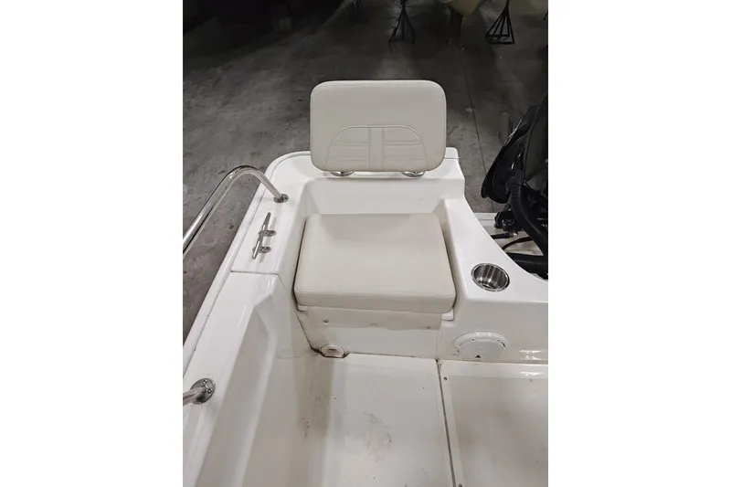 Slide: The Image of 2025 Boston Whaler 190 Montauk boat seat with cup holder and railing. - 9