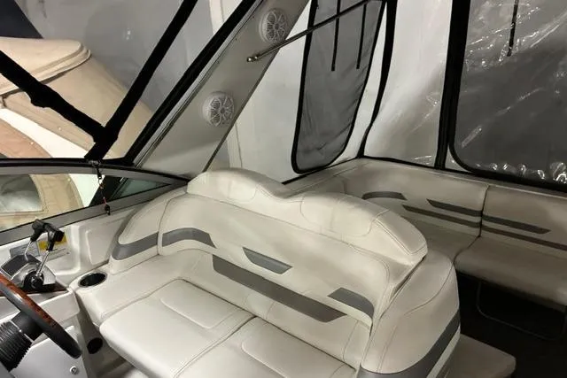 Slide: The Image of Interior of a 2004 Formula 31 Performance Cruiser with white seating and dashboard. - 11