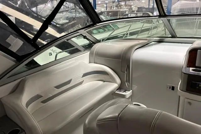 Slide: The Image of 2004 Formula 31 Performance Cruiser interior with white seating and dashboard. - 12