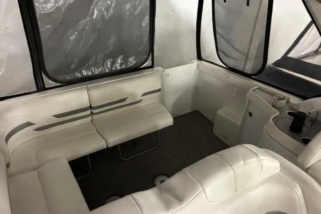 Slide: The Image of 2004 Formula 31 Performance Cruiser interior with white seating and enclosed windows. - 14