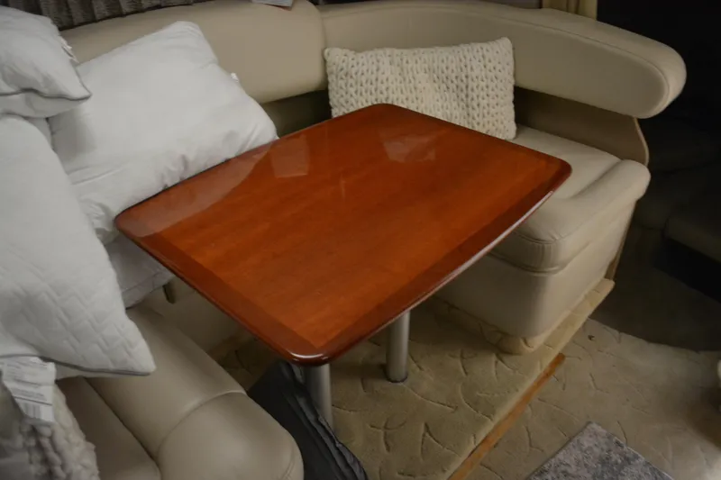 Slide: The Image of Interior of 2004 Formula 31 Performance Cruiser with wooden table and cushioned seating. - 19