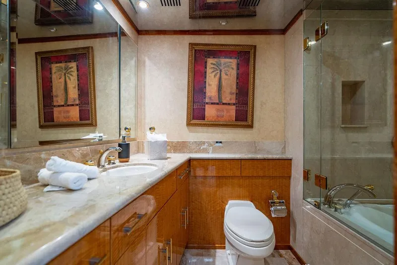 Slide: The Image of Luxurious bathroom in a 2001 Intermarine Raised Pilothouse yacht with elegant decor and modern amenities. - 16