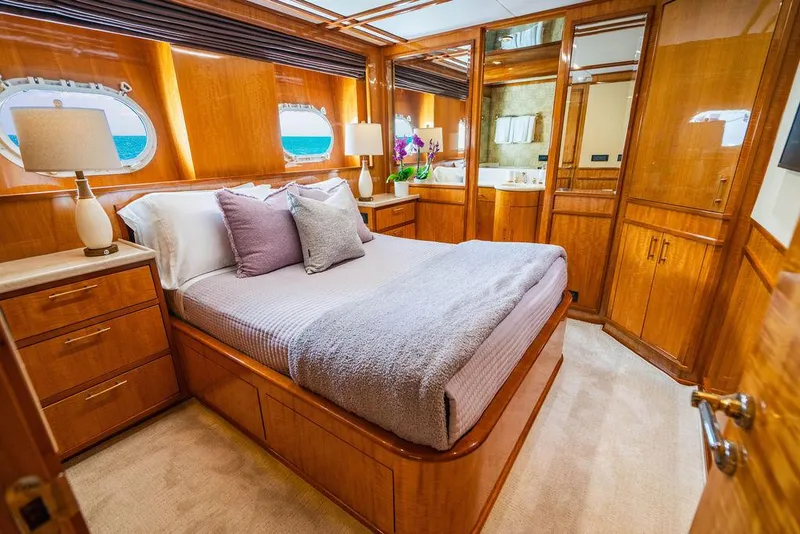 Slide: The Image of Luxurious bedroom on a 2001 Intermarine Raised Pilothouse yacht with wooden interiors. - 19