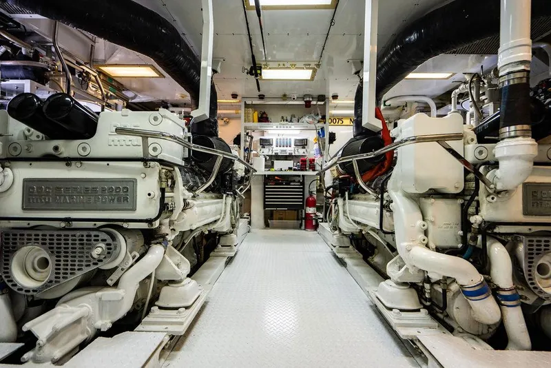 Slide: The Image of Engine room of a 2001 Intermarine Raised Pilothouse yacht with twin diesel engines. - 32