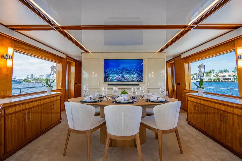 Slide: The Image of Luxurious dining area on a 2001 Intermarine Raised Pilothouse yacht with waterfront views. - 7