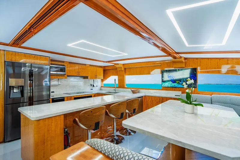 Slide: The Image of Luxurious kitchen interior of 2001 Intermarine Raised Pilothouse yacht with modern appliances and seating. - 8