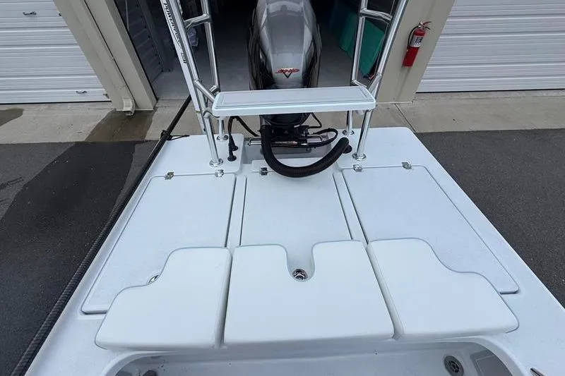 Slide: The Image of 2025 Cayo Boatworks 180 deck view with motor and storage compartments. - 11