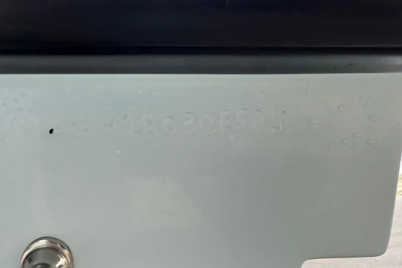 Slide: The Image of Close-up of a 2025 Cayo Boatworks 180 hull identification number. - 18