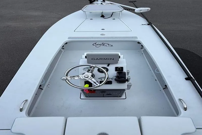 Slide: The Image of 2025 Cayo Boatworks 180 with Garmin navigation system, sleek white design. - 8