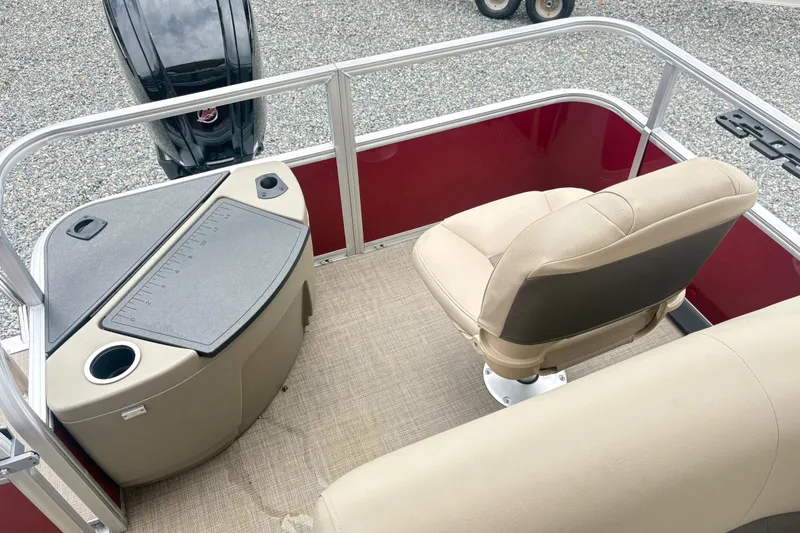 Slide: The Image of 2025 Sun Tracker Bass Buggy 18 DLX boat interior with seating and console. - 12