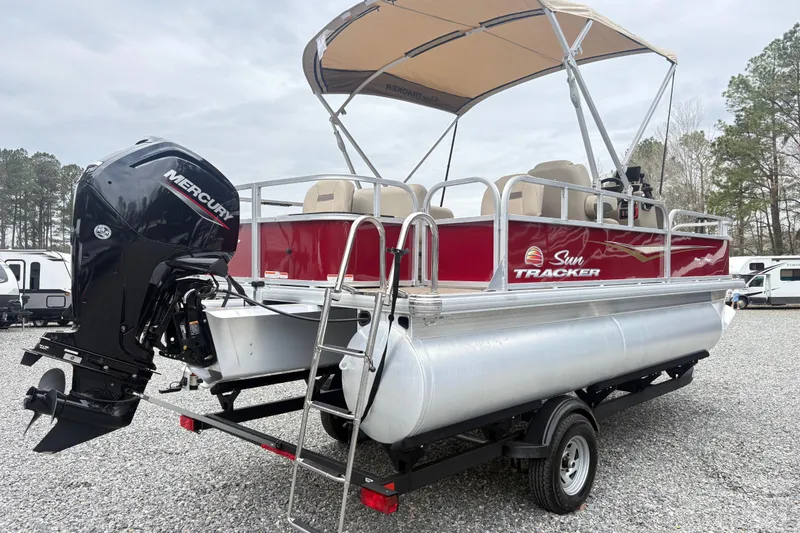 Slide: The Image of 2025 Sun Tracker Bass Buggy 18 DLX pontoon boat with Mercury outboard motor. - 3