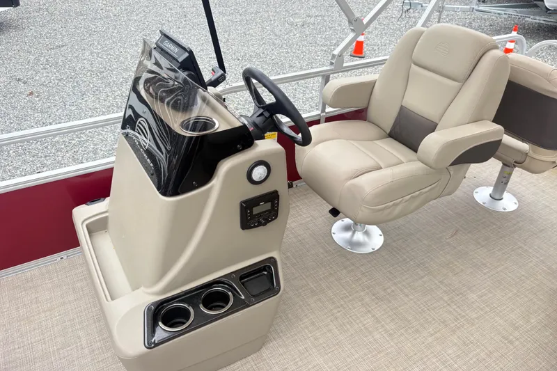 Slide: The Image of 2025 Sun Tracker Bass Buggy 18 DLX interior with steering console and comfortable seating. - 9