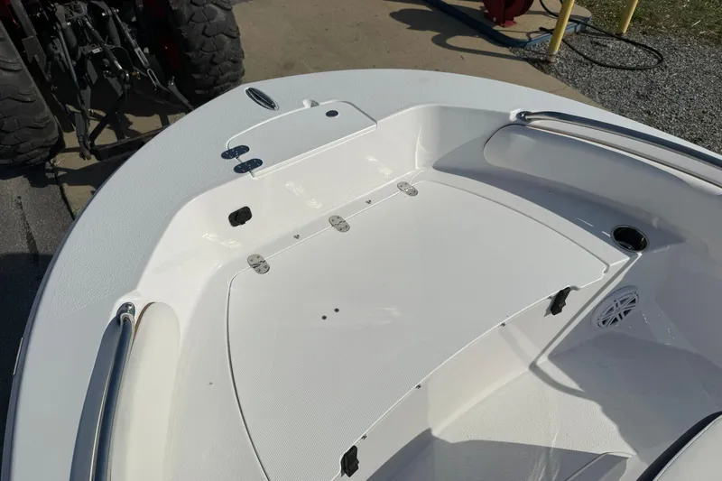 Slide: The Image of 2026 Stingray 173 CC boat interior with white deck and seating area. - 17