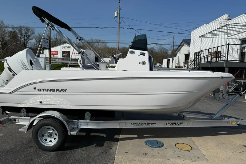 Slide: The Image of 2026 Stingray 173 CC boat on trailer, side view, outdoors. - 4