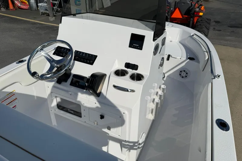 Slide: The Image of 2026 Stingray 173 CC boat console with steering wheel and controls. - 7