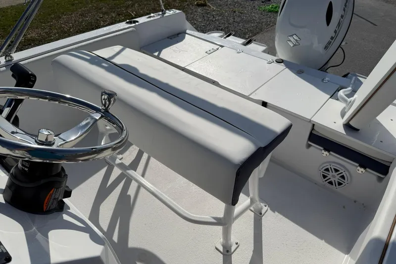 Slide: The Image of 2026 Stingray 173 CC boat interior with steering wheel and seating. - 8