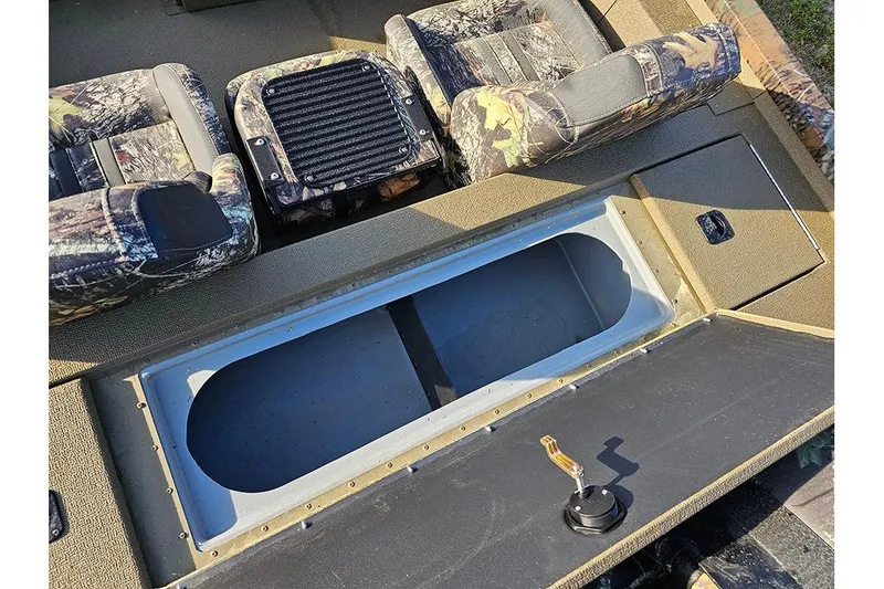 Slide: The Image of 2026 G3 Sportsman 1810 boat interior with camo seats and storage compartment. - 13
