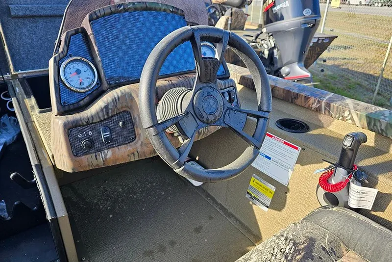 Slide: The Image of 2026 G3 Sportsman 1810 boat dashboard with steering wheel and controls. - 15