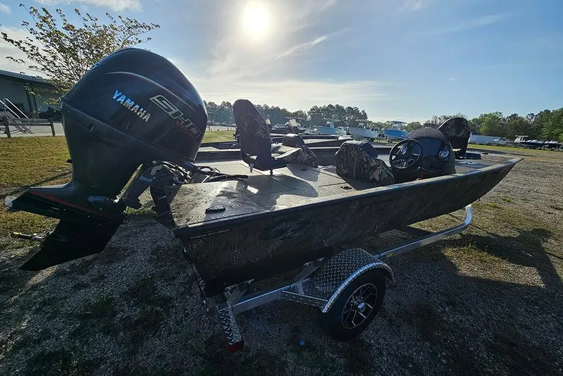 Slide: The Image of 2026 G3 Sportsman 1810 boat with Yamaha engine on trailer, parked outdoors. - 5