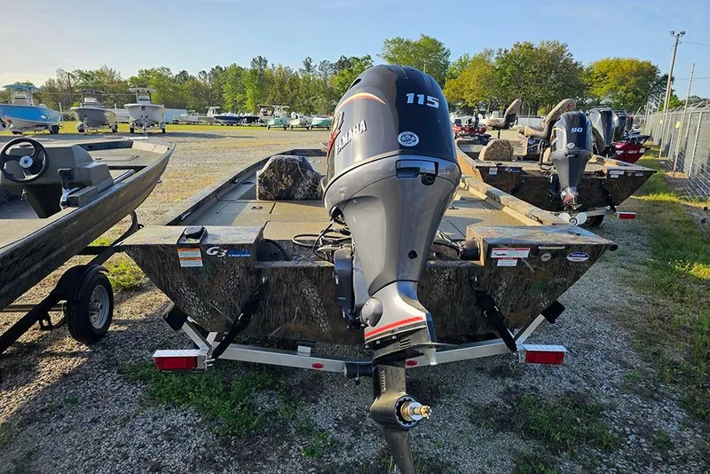 Slide: The Image of 2026 G3 Sportsman 1810 boat with Yamaha 115 outboard motor in a lot. - 6