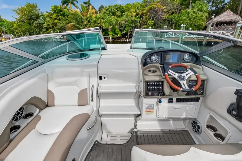 Slide: The Image of Interior of a 2019 Crownline 264 CR boat with helm console. - 18