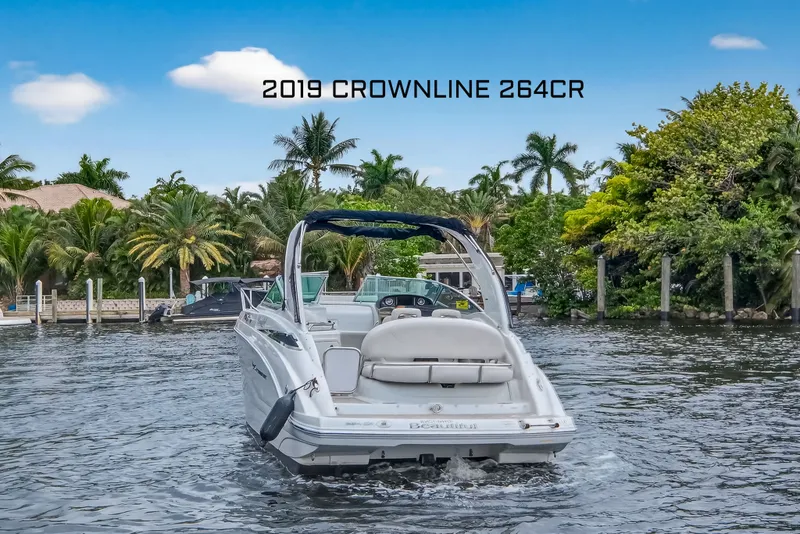 Slide: The Image of 2019 Crownline 264 CR boat on tropical waters. - 2