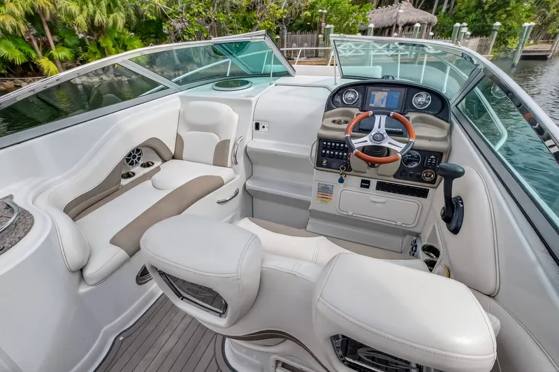 Slide: The Image of Interior of a 2019 Crownline 264 CR boat with helm console. - 24