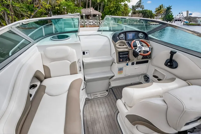 Slide: The Image of Interior of a 2019 Crownline 264 CR yacht with helm console. - 25