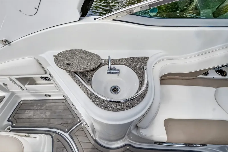 Slide: The Image of Crownline 264 CR 2019 with integrated sink and seating area. - 26
