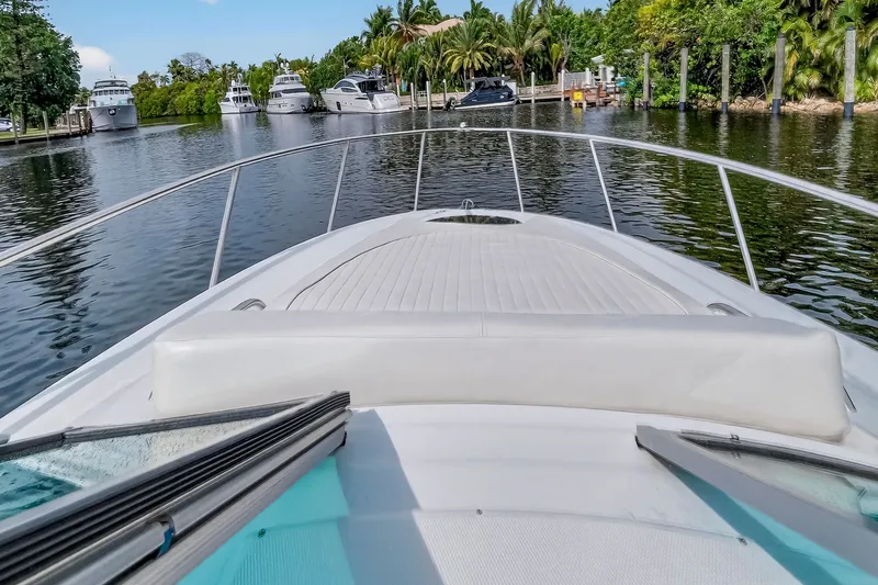 Slide: The Image of Crownline 264 CR 2019 on calm water with yachts in background. - 28