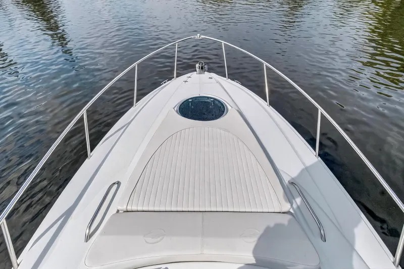 Slide: The Image of 2019 Crownline 264 CR boat on calm water. - 29