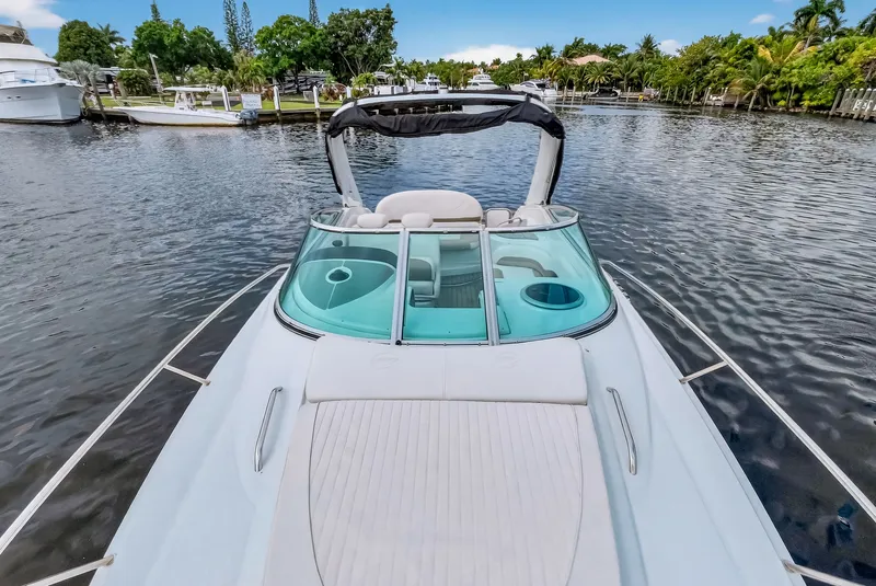 Slide: The Image of 2019 Crownline 264 CR boat on calm water. - 30