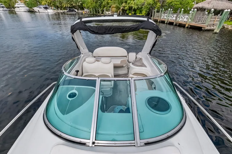 Slide: The Image of 2019 Crownline 264 CR boat on calm water. - 31