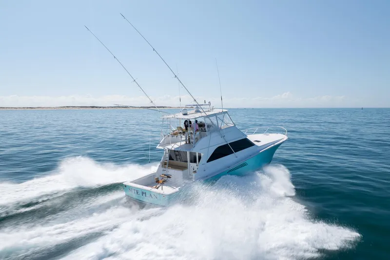 Slide: The Image of Viking 55 Convertible 2000 yacht cruising on open sea with wake trails. - 15