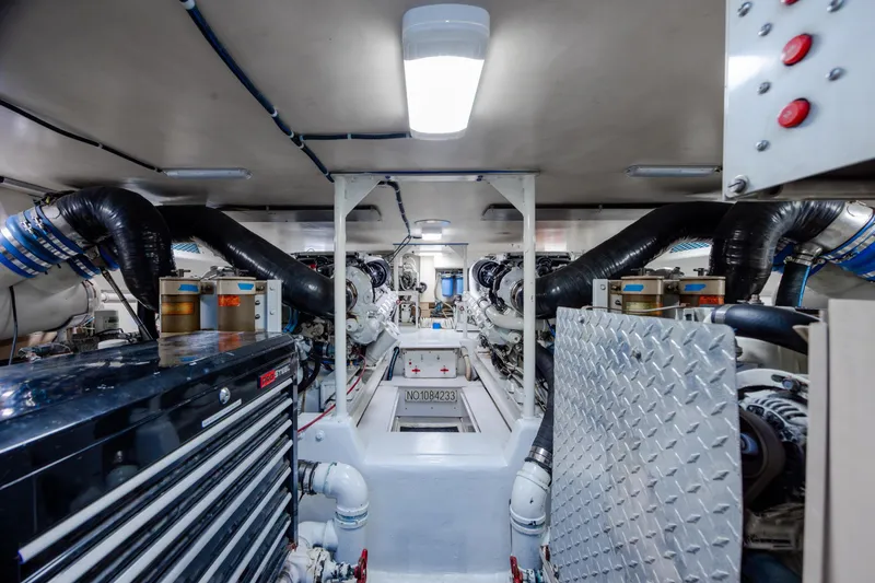 Slide: The Image of Engine room of a 2000 Viking 55 Convertible yacht, showcasing machinery and equipment. - 19