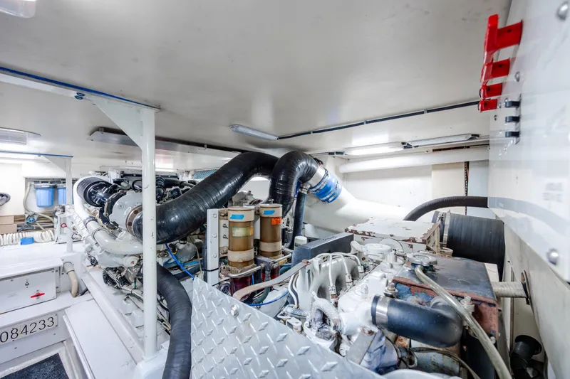 Slide: The Image of Engine room of a 2000 Viking 55 Convertible yacht, showcasing machinery and components. - 21