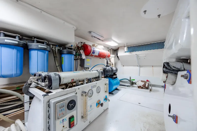 Slide: The Image of Engine room of 2000 Viking 55 Convertible yacht with filtration system and equipment. - 27