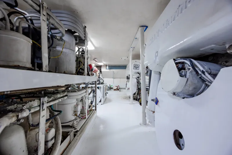 Slide: The Image of Engine room of a 2000 Viking 55 Convertible yacht, showcasing machinery and equipment. - 30