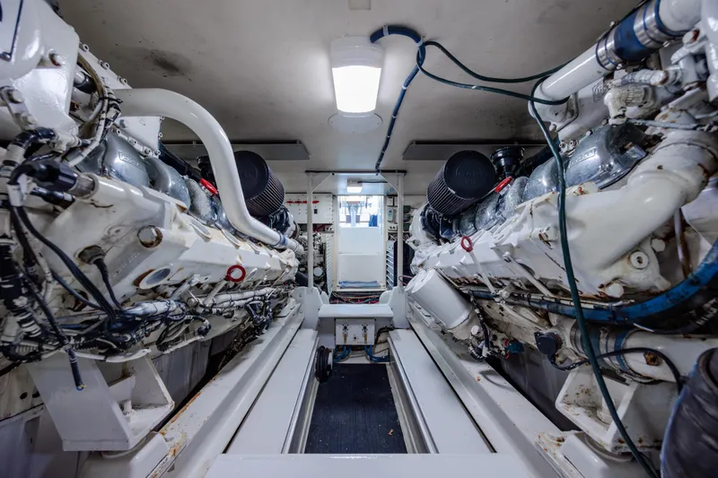Slide: The Image of Engine room of a 2000 Viking 55 Convertible yacht, showcasing dual powerful engines. - 31