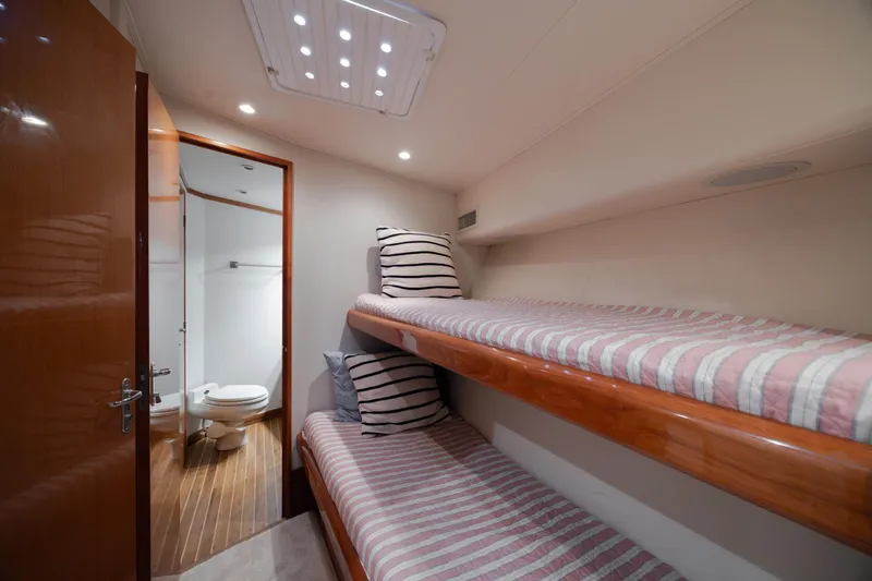 Slide: The Image of Interior of 2000 Viking 55 Convertible yacht with bunk beds and bathroom. - 35