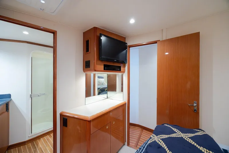 Slide: The Image of Interior of 2000 Viking 55 Convertible yacht with wood cabinetry and modern amenities. - 42