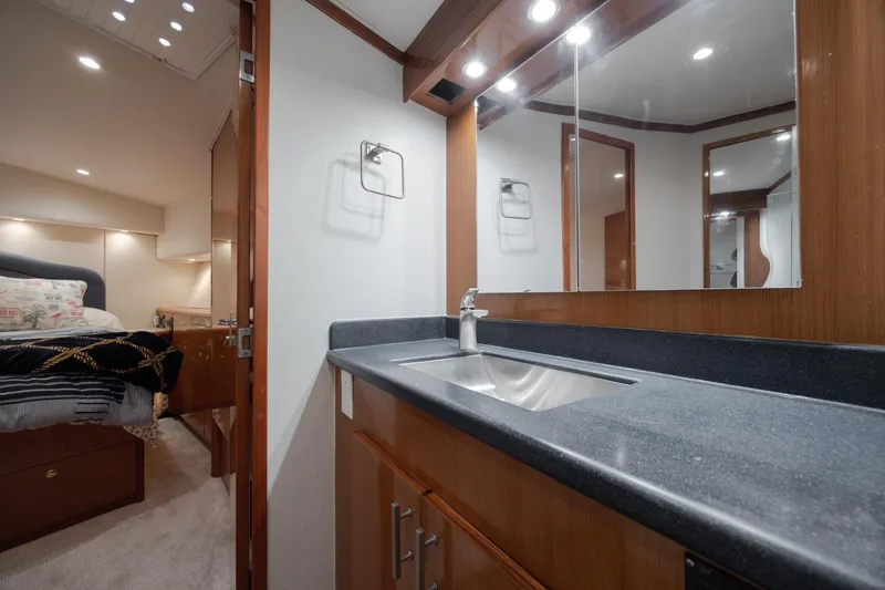 Slide: The Image of Luxurious bathroom and bedroom interior of a 2000 Viking 55 Convertible yacht. - 44