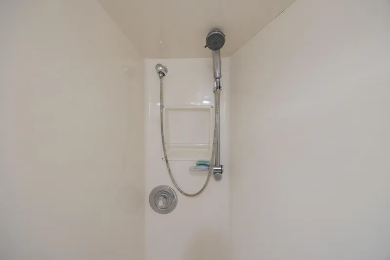 Slide: The Image of Shower area in 2000 Viking 55 Convertible yacht with handheld showerhead. - 45