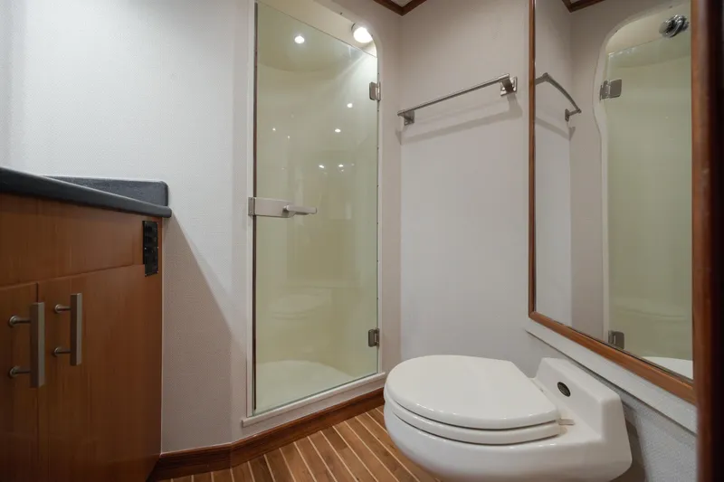 Slide: The Image of Bathroom interior of 2000 Viking 55 Convertible yacht with shower and toilet. - 46